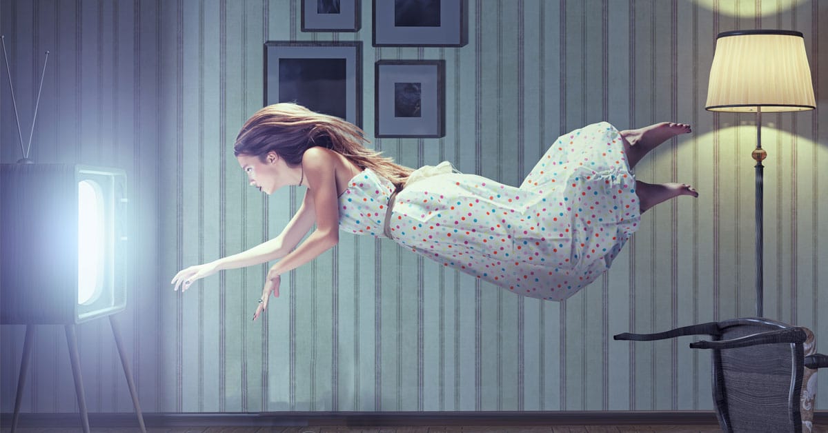 A woman in a dress soaring over a television, symbolizing the vivid dreams people have.