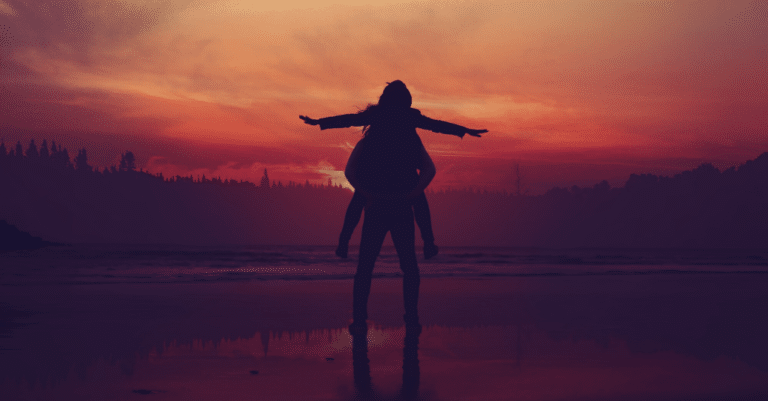 A silhouette of a person embodying personal values on the beach at sunset.