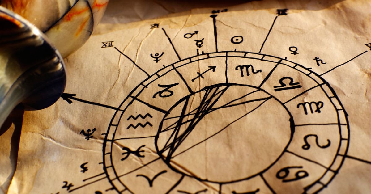 A horoscope drawing on paper revealing birth month insights and future predictions.
