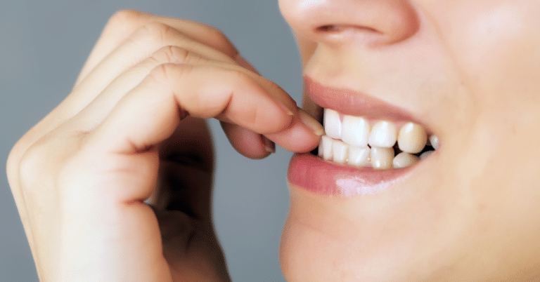 A woman's oral hygiene habit involving her finger potentially triggers chronic stress.