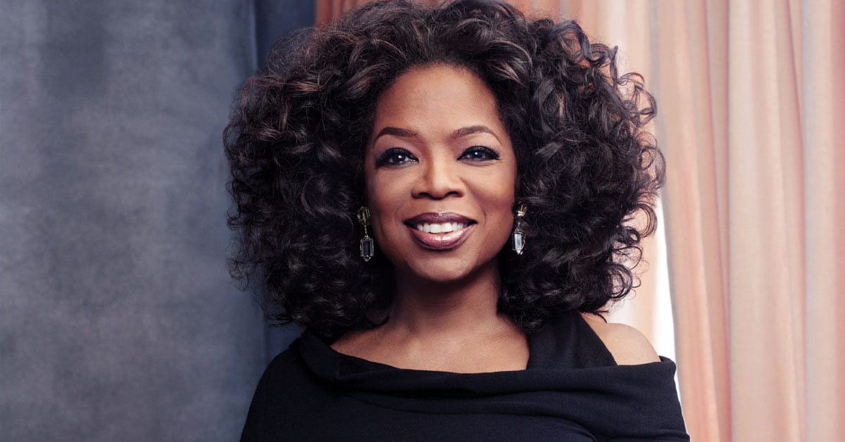 Oprah winfrey is posing for a photo.