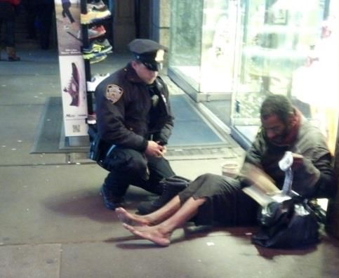 An officer buys a homeless man some shoes.