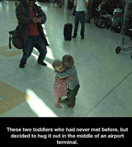 Toddlers demonstrate how there's never a bad time for a cuddle...